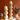 Set of two Aspen & Fig hand-carved wooden stacked ball candle holders, approx. 5.5″ × 16.5″, with wax-dipped finish.