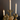 Aspen & Fig gold resin deer taper candle holder—8-inch tall with antler base holding a single taper candle.
