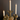 Aspen & Fig gold resin deer taper candle holder—8-inch tall with antler base holding a single taper candle.