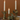 Aspen & Fig gold resin deer taper candle holder—8-inch tall with antler base holding a single taper candle.