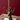 Aspen & Fig gold resin deer taper candle holder—8-inch tall with antler base holding a single taper candle.