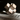 Aspen & Fig jack sculpture carved from Capri beige marble, 4.5 inches wide with natural veining and sculptural form.